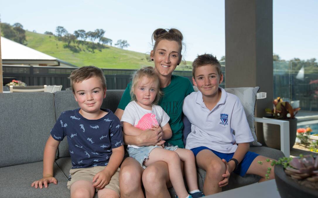 MY VILLAGE: Christy Milton is taking part in the Walk for Epilepsy on Sunday with her children Elijah, 3, Charlotte, 2, and Joseph, 9. Picture: TARA TREWHELLA