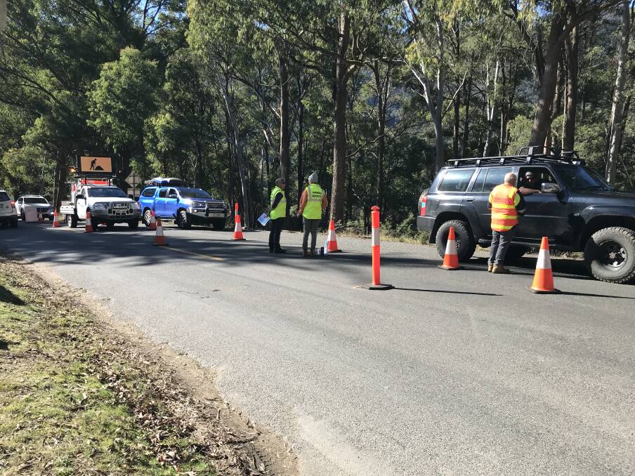 PRECAUTION: Hotham resort staff were checking cars on the outskirts of Harrietville, like their counterparts in Mount Beauty, to ensure Melburnians had negative tests.