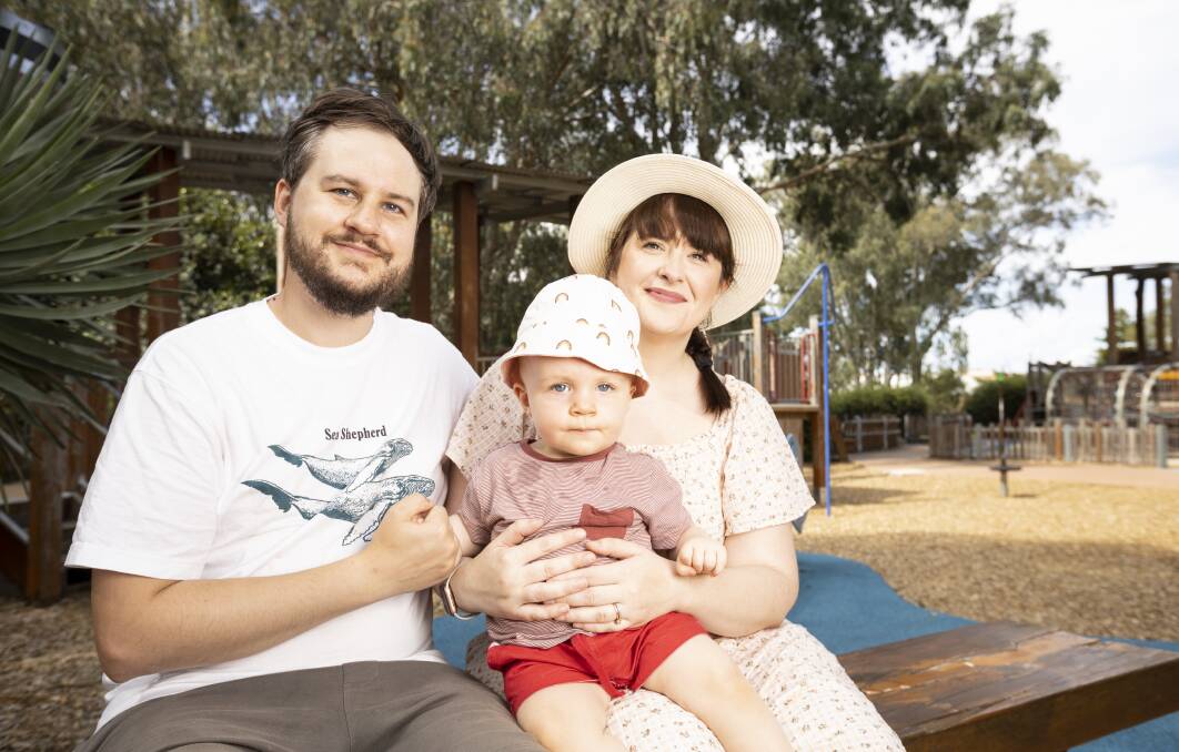 COOL: James and Sam Gallimore, with Otis, 10 months, welcome an audit of council's play spaces such as Oddies Creek Park to determine the amount of shade coverage. Findings will come to the May meeting. Picture: ASH SMITH
