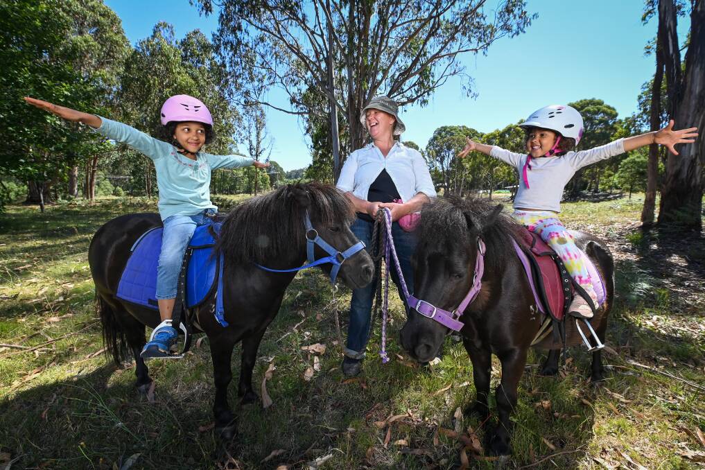 FUN: Emilia Gladstone has started pony rides in Stanley - enjoyed by Kadidia Diallo-Gladstone, 5, and Aminata, 2. Picture: MARK JESSER