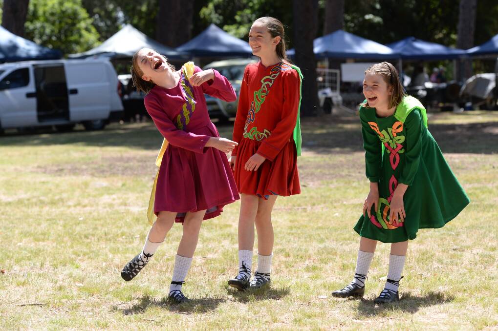 COLOURFUL CHARACTERS: Sisters Dannan 10, Tahlia, 13, and Siahn O'Sullivan, 10, from Table Top ready to dance at the Beechworth Celtic Festival on Saturday. Picture: MARK JESSER