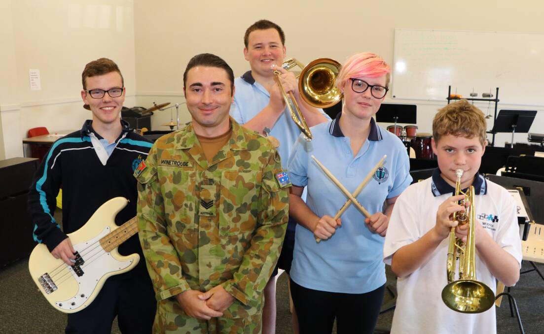 TUNE UP: Ryan Durrant, Tom Nunan,  Jessica Rose and Bayden McKell were on hand to work with Sergeant Bernard Winetroube from the Australian Army Band Kapooka. Picture: NICHOLAS QUINHAMPTON 