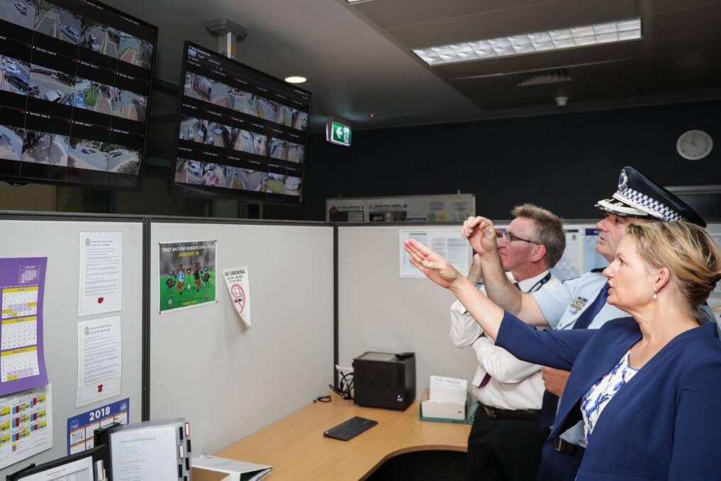 LOOK OUT: Albury mayor Kevin Mack and Farrer MP Sussan Ley joined Superintendent Quarmby to view the feed from the 52-camera network inside the Albury Police Station. Picture: JAMES WILTSHIRE