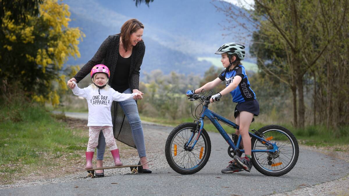 RIDE AND RUN: Chilali Smith, 3, from Tawonga South, and Jamie Heman, 7, from Tawonga South, with member for Northern Victoria Jaclyn Symes. Picture: KYLIE ESLER