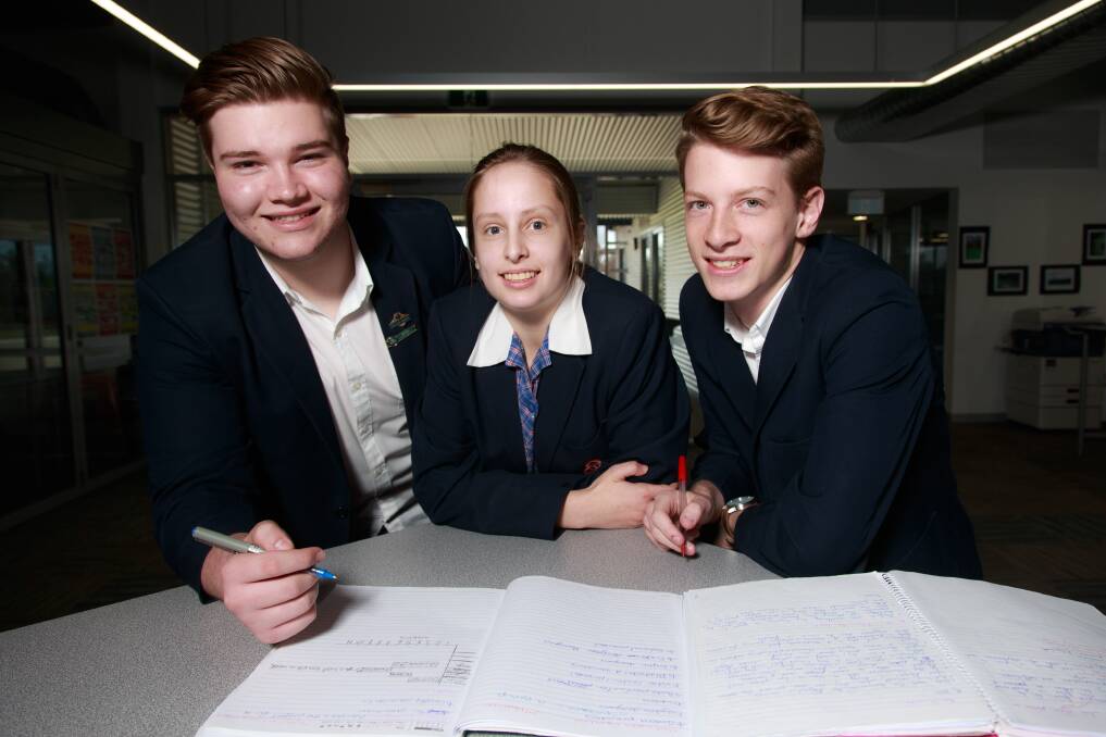 WRITING A FUTURE: Trinity Anglican College's Nicholas Coleshill, 17, Danielle Conibear, 18, and Max Barter, 18, before their HSC English exam. Picture: SIMON BAYLISS