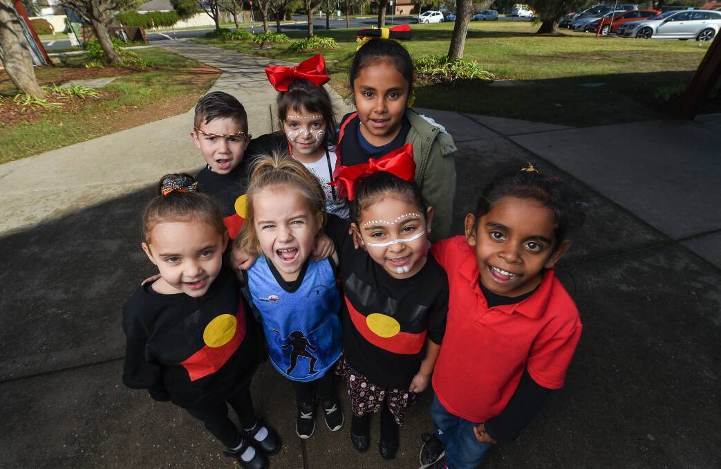 TRUE COLOURS: Thurgoona Public School students dressed up to raise money for a new flagpole to fly the Aboriginal flag.  Nariah Ingram, 5, kinder, Tammika Jones, 5, kinder, Assante Collins, 5, kinder and Lameah Hunter, 7, grade 1.  BEHIND: Blayde Clark, 5 kinder, Shiloh Hoffmann, 6, grade 1 and Takeah Williams, 9, grade 4. Picture: MARK JESSER