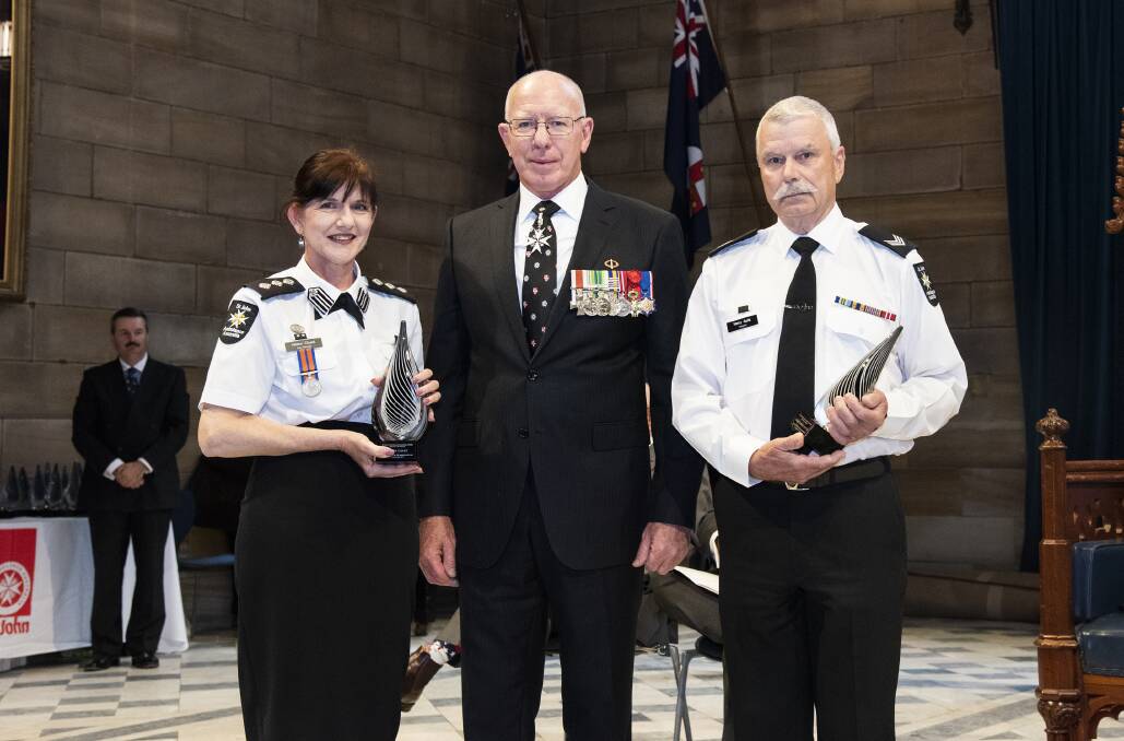 HEROES: St John Ambulance officers Helen Chant and Harry Apitz with NSW Governor, the Honourable David Hurley after being presented with their awards.