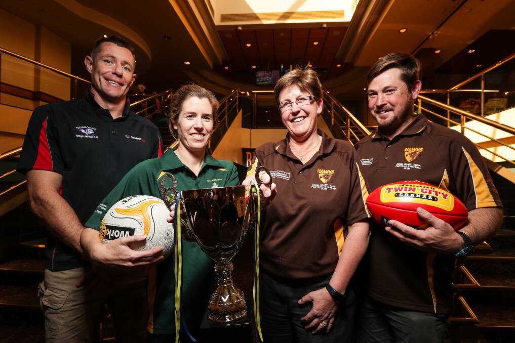 Jamarl O'Sullivan, Anna Avery, Kath Evans and Adam Mudra with the premiership cup. Picture: JAMES WILTSHIRE