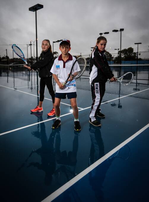 READY: Rising tennis stars Chelsea McGrath, 12, Rory Parnell, 10, and Ella Brown, 11, are off to NSW state tennis championships in Tweed Heads next week. Picture: JAMES WILTSHIRE