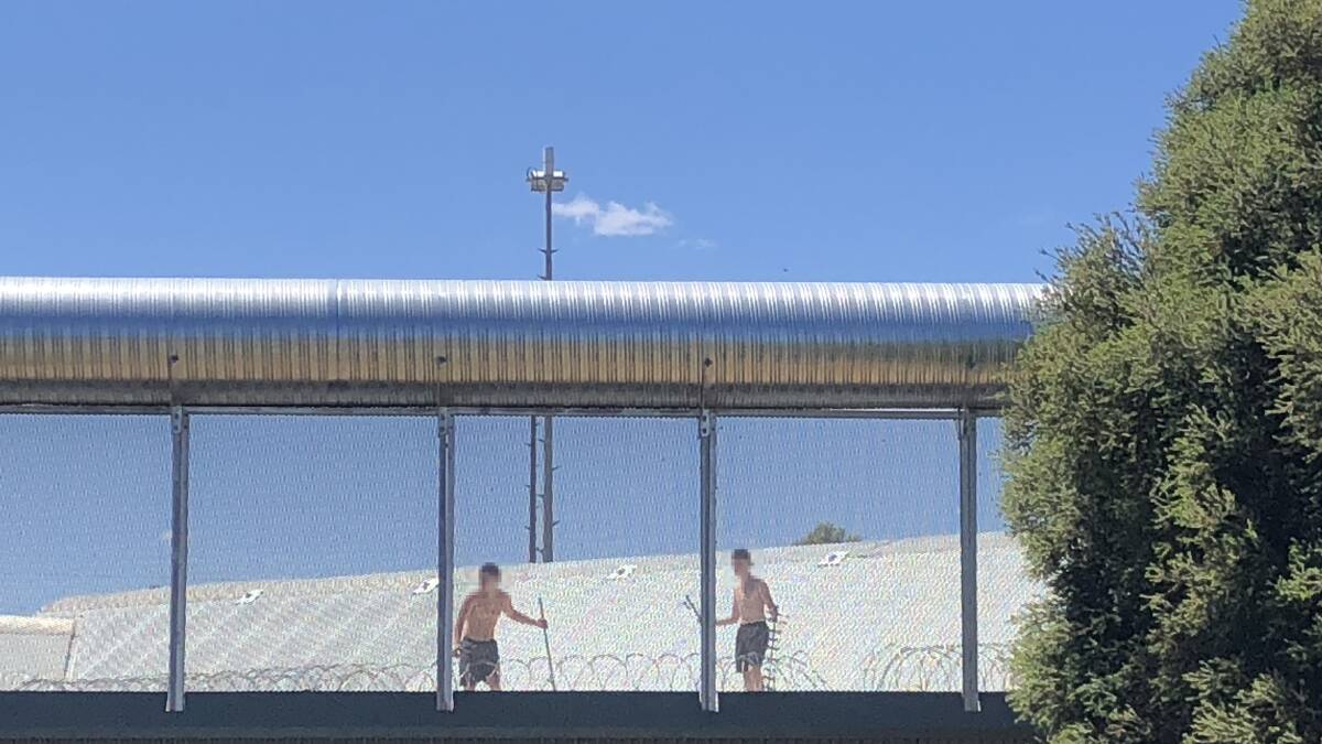 The detainees were seen throwing rocks at passing cars on Glenfield Road. Picture: Jess Whitty