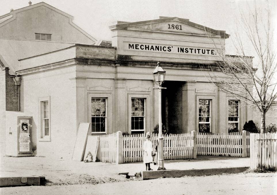 HISTORIC: The Mechanics Institute, circa 1885. Note the theatre behind, the poster advertising the Jubilee Singers, the lady with two children, one behind the gas street light, the second sitting at left.