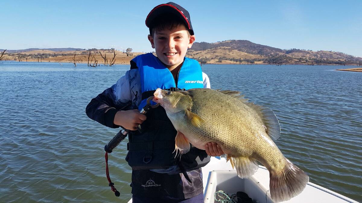 YOU BEAUTY: Young fisho Zack Emmett, 9, shows of a 60cm yellowbelly he caught out on Lake Hume recently. Remember to send your pictures, along with a few details, to 0475 947 279 or 0475 953 605.