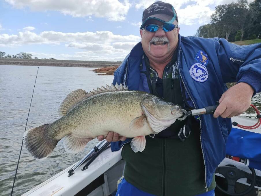 SUPER CATCH: Garry Simonis poses with an out of season, released bycatch Murray cod. He caught it at Lake Hume, with the measurement going 67cm. Remember that you can send your pictures in to 0475 953 605.