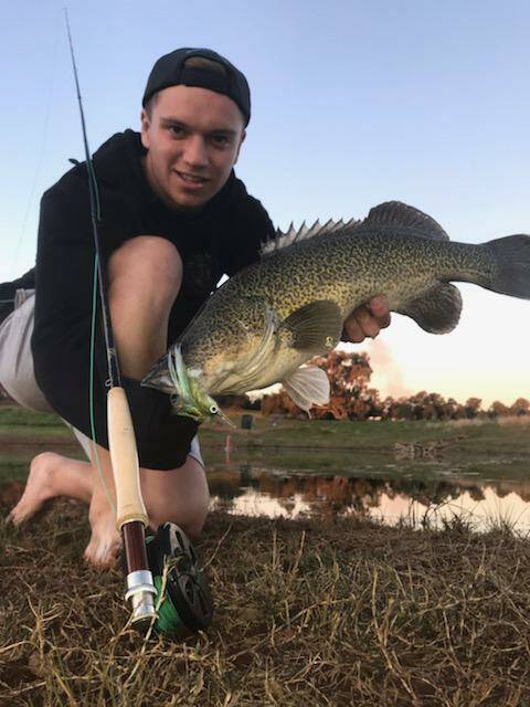 SUCCESS: Eddy Z sure was happy after catching this handsome specimen while fishing on the fly. Remember that you can send your pictures to 0475 947 279.