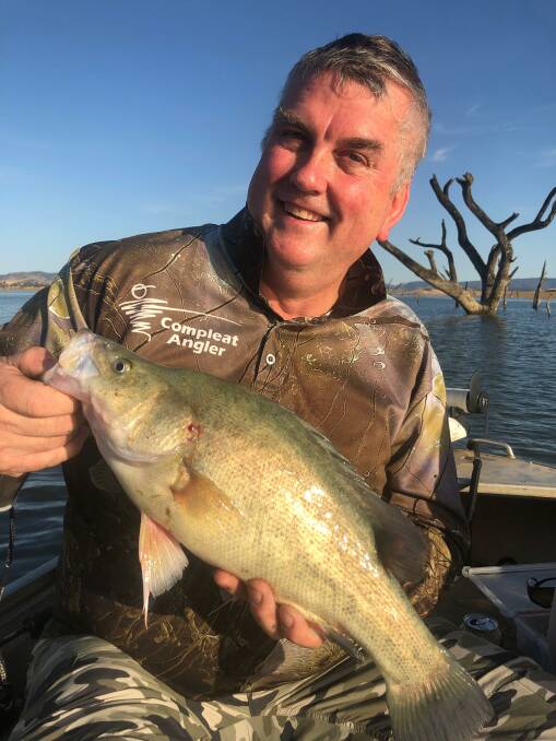 SUPER CATCH: Graeme Wilson with a yellowbelly he flicked up on a blade. Lake Hume has been improving lately, though it's been better for some than others.