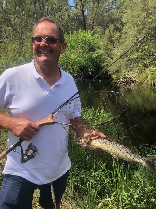 SENSATIONAL: Peter Mason was pretty happy with a decent streamie he caught from the Snowy Creek above Mitta. It was caught on a slim minnow.