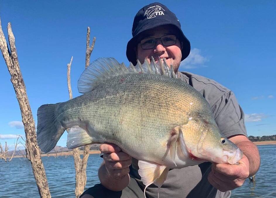 SENSATIONAL: Aaron Mills was pretty pleased after nabbing this terrific-looking yella while fishing off a boat at Lake Hume with his mate, Josh Reid.
