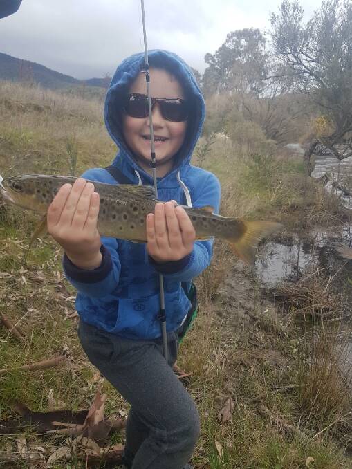 NOT BAD AT ALL: Archie Donnelly, 7, shows off the trout he caught with dad Dave in the streams on opening day. Remember that you can send your fishing pictures, along with a few lines, to 0475 947 279 or 0475 953 605.