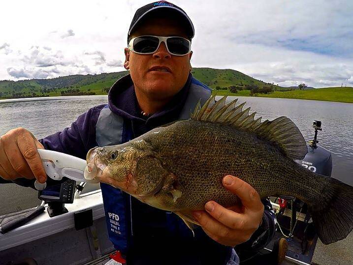 RIGHT MOVE: Trent Free was happy with himself after using a stripped redfin vibe lure to bring this super fish in while fishing on a boat at Lake Hume.