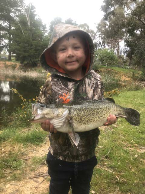 BEAUTY: Young Ben hooked this little beauty while visiting a friend's property for an overnight camping trip recently. As cod season is closed, the fish was returned.