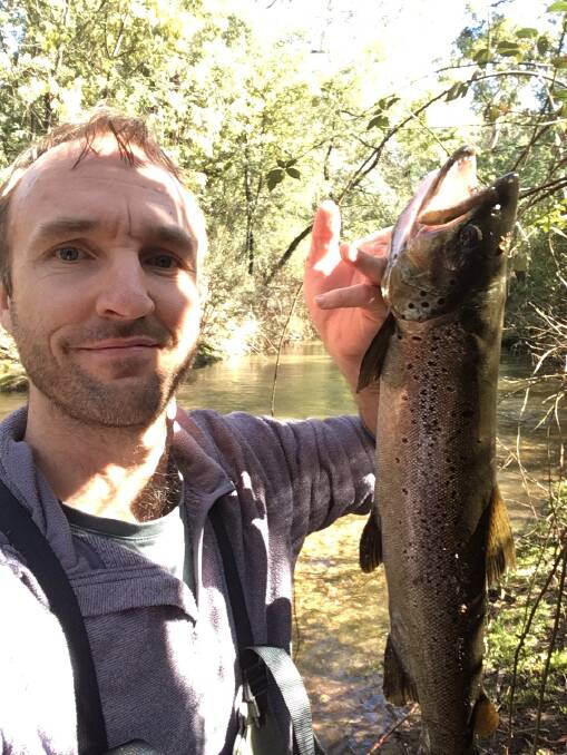 YOU BEAUTY: Scott Gatehouse caught this 63cm brown trout on a rooster tail in a stream about 30 minutes from Myrtleford. It weighed in at just under 2kg. 