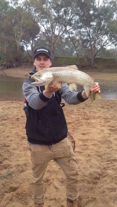 RIPPER: Rhys Wilson caught this 68cm trout while casting a soft plastic on the Murray River near Albury. Rhys is among those who have had a good run lately. 