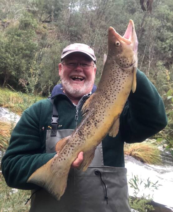 WORTH THE TRIP: Yours truly Russell Mason caught this 67cm trout on Wednesday morning, a few hours after fishing restrictions were eased in the Mitta Valley.