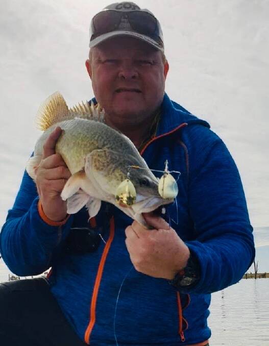 BACK AT IT: Mark Larsen shows off a small cod that he managed to nail over at Lake Mulwala on Wednesday. Mark did mention that the water there was fairly dirty.