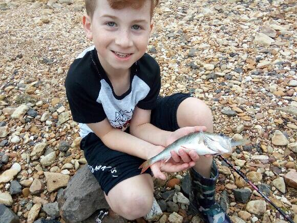 WOW: The holidays are a great time for the young ones to get into fishing. Reader Herc's nine-year-old son caught a small red fin which had been eaten by an ever bigger one. Send your fishing pictures to 0475 953 605.