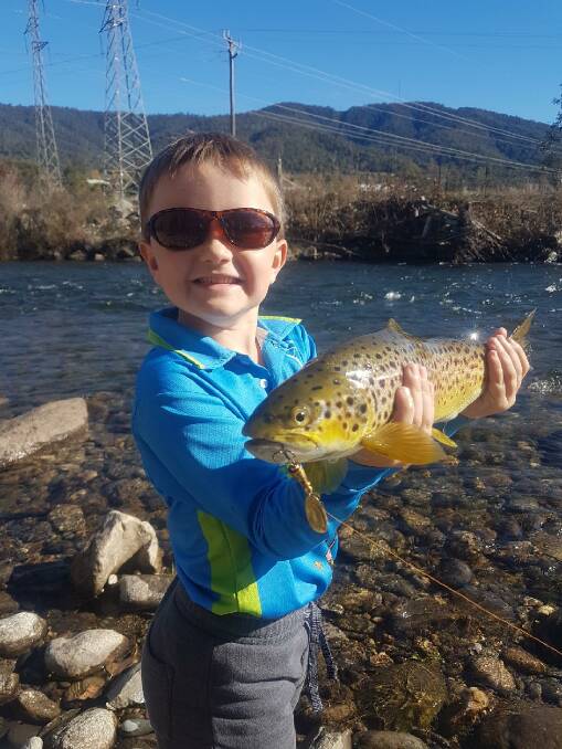YOU BEAUTY: Keen young angler Archie and his dad, Dave Donnelly walked the Kiewa River at Mt Beauty recently, with Archie landing this ripper on a gold vibrax. It measured 45cm and was in good condition. It was released. 