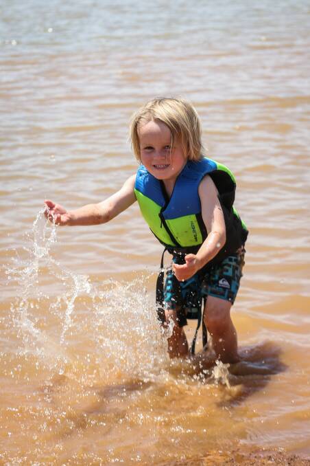 Families take advantage of the cool water and hot weather for the summer holidays.