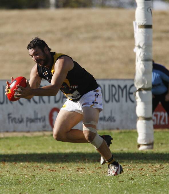 MARKED ANOTHER ONE: Glenrowan forward Chris Sussyer grabs the ball not far out from the posts in a game where he booted a club-record 14 goals. Pictures: WANGARATTA CHRONICLE