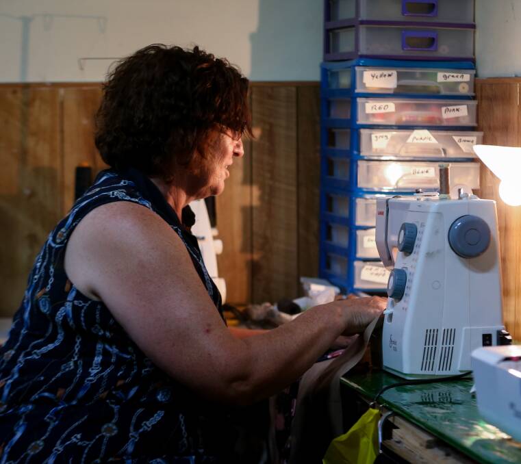 UNDER REPAIR: Sue Ellen Hillier works away on a repair job in the back room of the old shop on High Street.