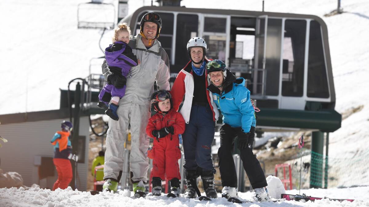 SNOW WORRIES: Henry, Caroline, George and Kristy Taylor with Alison Plasto at Mt Hotham. Photo: CHRIS HOCKING
