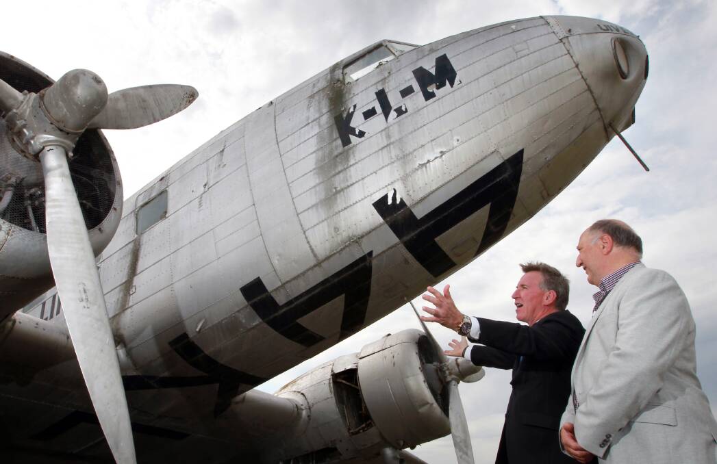 RESTORATION RESCUE: Uiver Memorial Community Trust chairman Pieter Mol, right, with former Albury mayor Kevin Mack when the plane changed hands 12 months ago. 