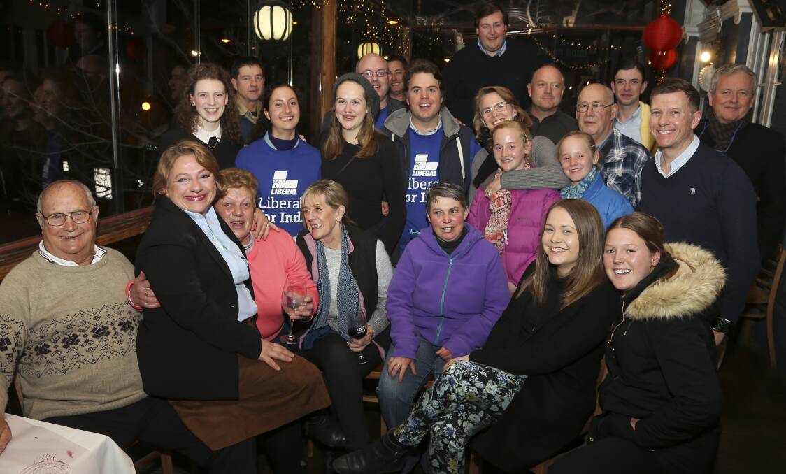 HANGING ON: Liberal candidate Sophie Mirabella and loyal supporters in Wangaratta on Saturday night. Picture: ELENOR TEDENBORG