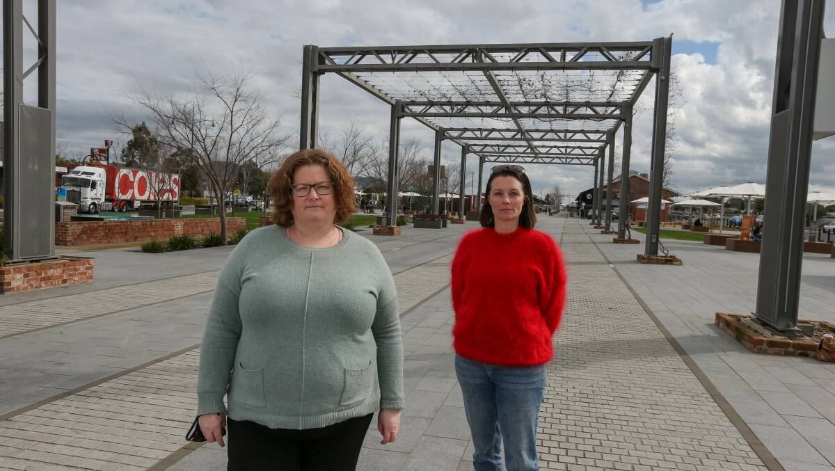 STANDING UP:Bobbi McKibbin, left, and Hannah Seymour are leading the fight to prevent a bottle shop being built in Junction Square formerly set aside for a cinema. Picture: TARA TREWHELLA