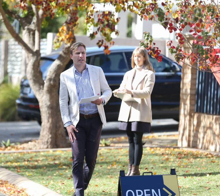 BIDDING FRENZY: Stean Nicholls auctioneer Jack Stean in action at the successful sale of the Finch Court home.