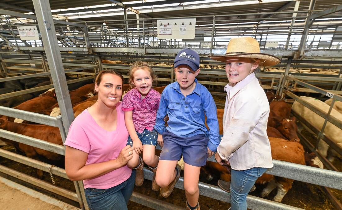 FAMILY FUN: Holbrook's Kelly Boers and children Lucy, 5, Jimmy, 8 and Mia, 10, at the final day of the Wodonga weaner sales.
