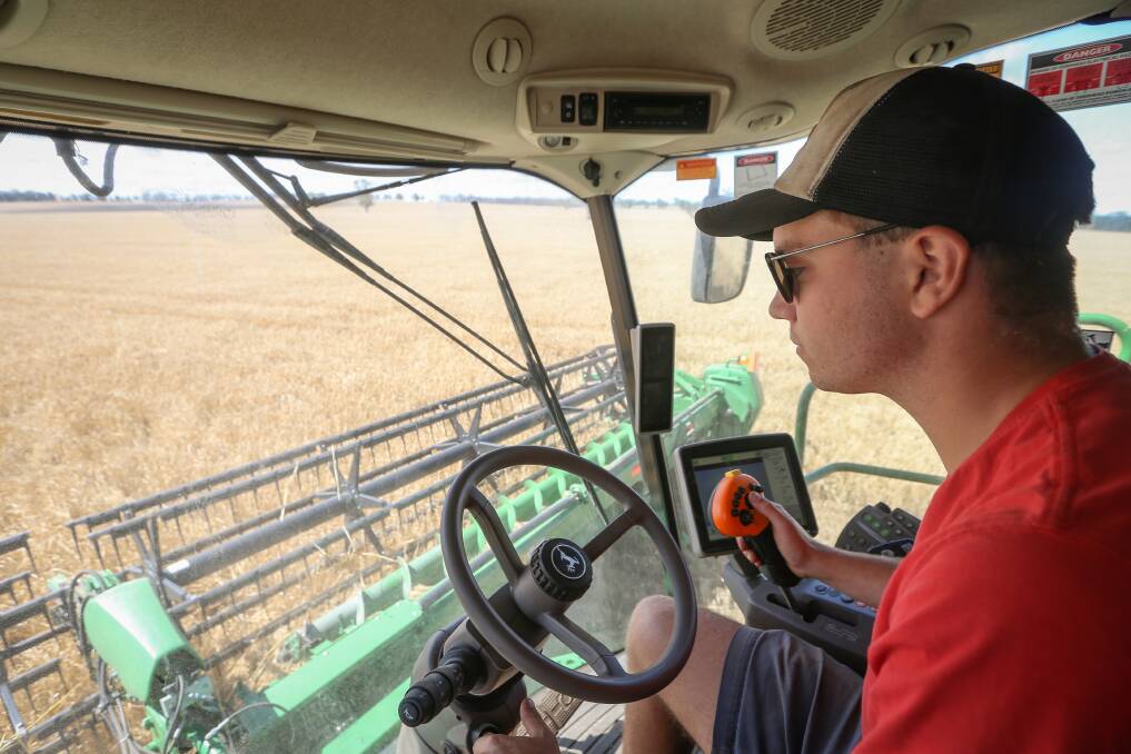 Burrumbuttock's Eddy Ziebarth hard at work during harvest. Picture: JAMES WILTSHIRE