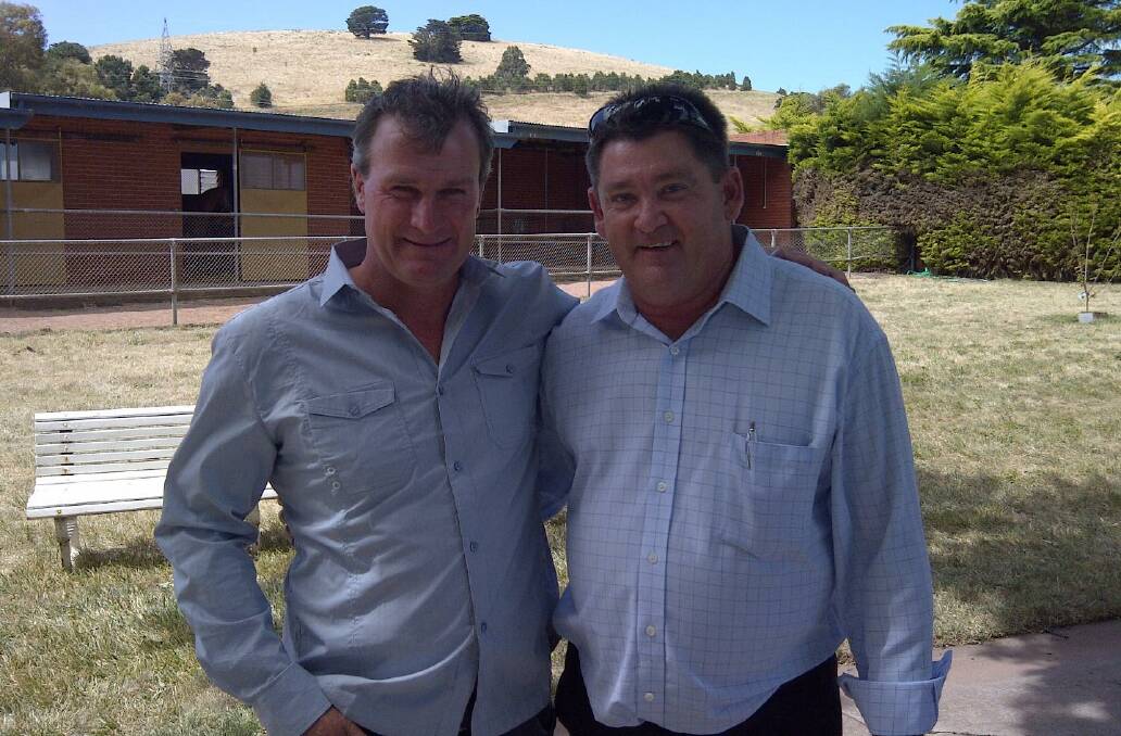 GOT YOUR BACK: Viking Racing syndicate manager John Howes, right and champion trainer Darren Weir at his Ballarat stables.