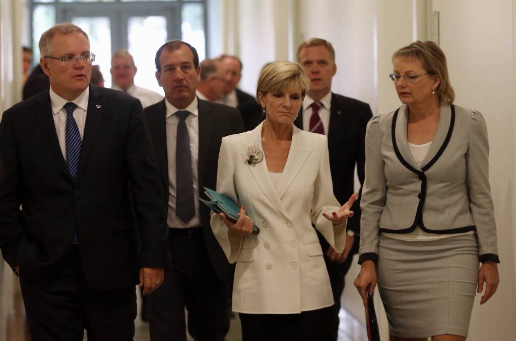 FLASHBACK: Sussan Ley, right, leaves the Liberal party room with Scott Morrison and Julie Bishop after the February 2015 unsuccessful attempt to roll Tony Abbott as Prime Minister.