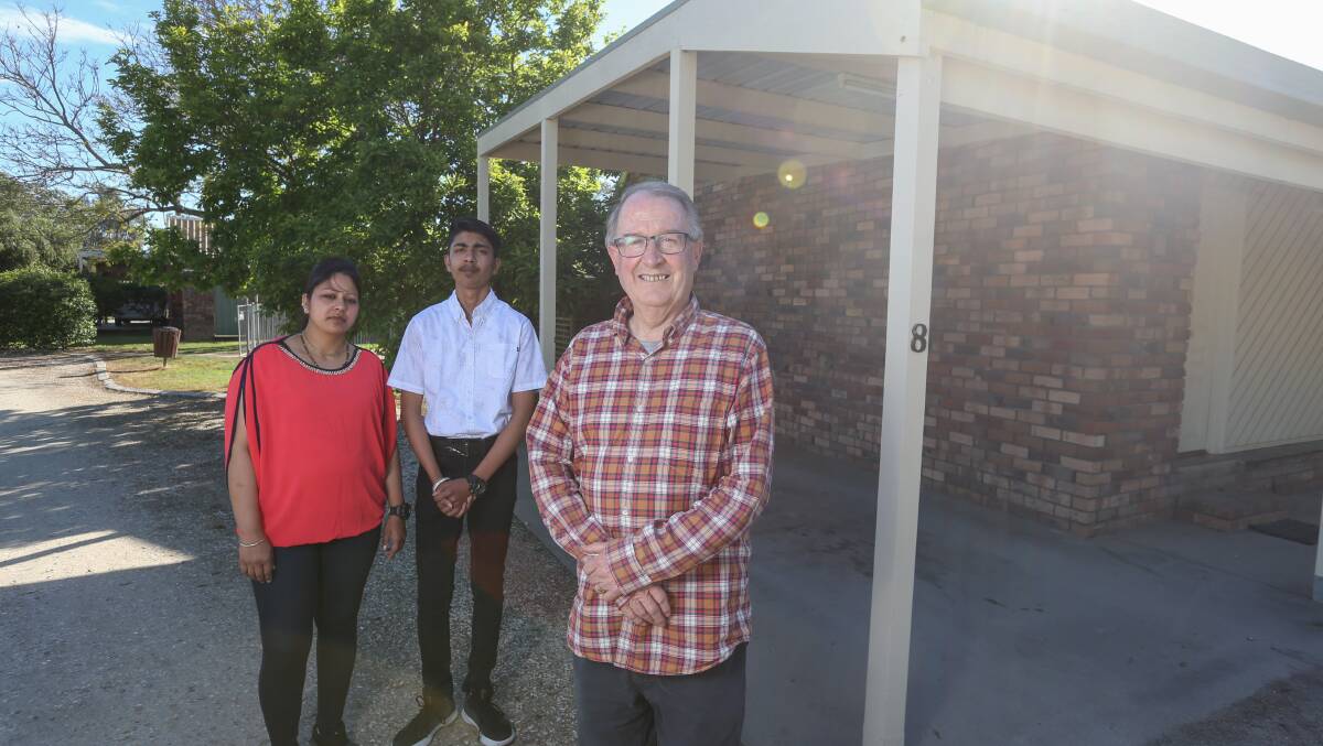 TROUBLED TIMES: Belvoir Village Motel owner Lloyd Deane, right, and business leasee Muskaan Gupta with son Dhruv. Picture: TARA TREWHELLA