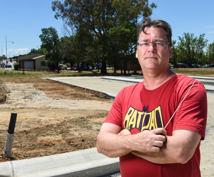 BRASSED OFF: Wodonga Brass musical director Bruce Cook behind the band hall at the newly created corner of Havelock and South streets. Picture: MARK JESSER