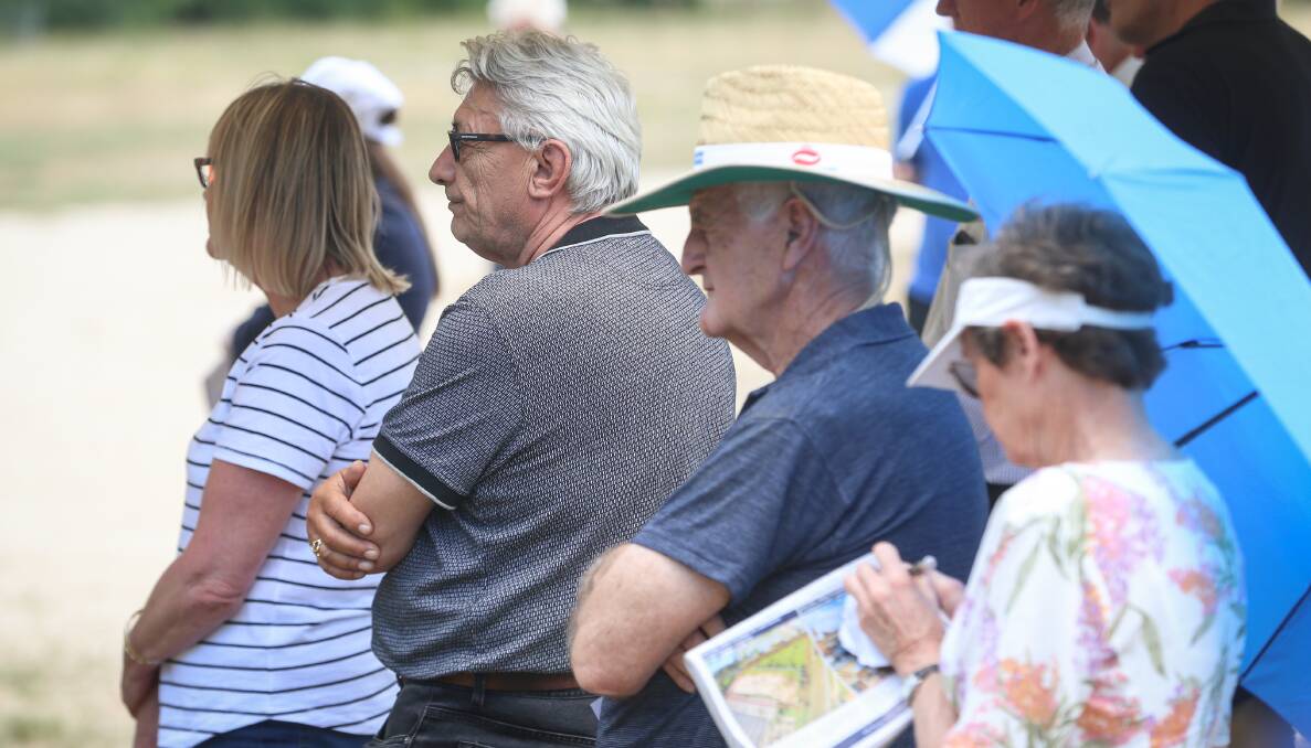 STRONG COMPETITION: Part of the crowd, including representative of the successful purchaser, second from left, at the auction of industrial land at Bandiana. Picture: JAMES WILTSHIRE