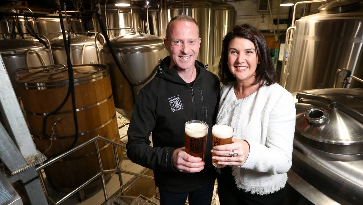 TOP DROP:Bridge Road Brewers chief executive Donald Mace and Senator Jane Hume toast recent expansion of the Beechworth business. Picture: JAMES WILTSHIRE