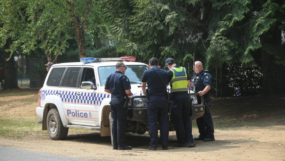 GET OUT NOW: Police arrived in Harrietville to help with the evacuation of the town ahead of a dire weather forecast in the area. Picture: JAMES WILTSHIRE