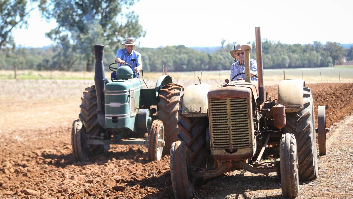 BYGONE ERA: Brothers Maurice and Bill Koschitzke wind back the clock to their farming days.