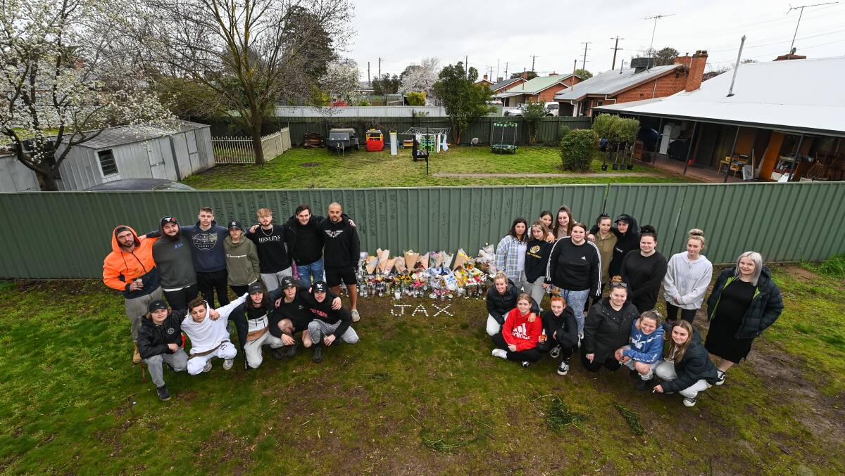 Friends of Jaxen Henderson-Gillespie gather at a tribute set up in Wangaratta following his stabbing death on Saturday. Picture: MARK JESSER