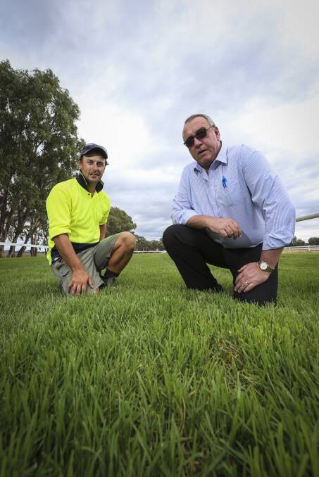 TICK OF APPROVAL: Albury Racing Club track staff member Ash Hockin and SDRA chief steward John Davidson inspect the track. Picture: JAMES WILTSHIRE